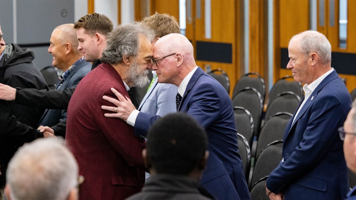 Two men hongi at the pōwhiri for the new board of directors.